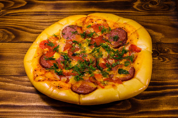 Fresh homemade pizza on a wooden table
