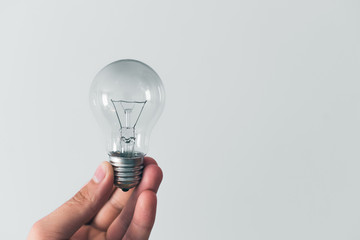 Bulb in hand, concept of idea