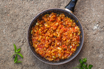 stewed vegetables - pumpkin, tomato, onions, carrots, zucchini, eggplant and more. . food background. top view