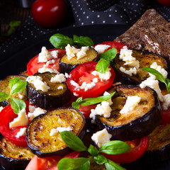 Eggplant grilled with aromatic feta cheese and tomatoes