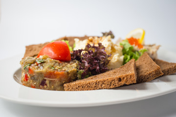 Roasted toasts with aubergine paste and red caviar