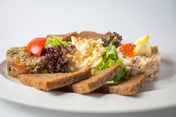 Roasted toasts with aubergine paste and red caviar