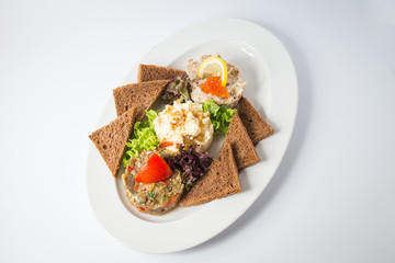 Roasted toasts with aubergine paste and red caviar