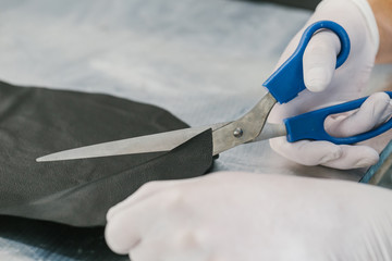 Cutting leather material with sharp scissors for carbon fiber bike seat underlay