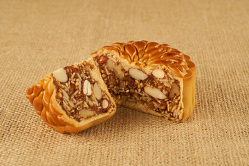 Delicious traditional round moon cake with nuts filling for harvest festival