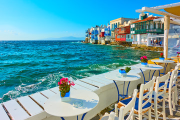Small cafe by the sea in Mykonos - obrazy, fototapety, plakaty