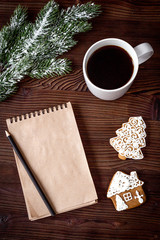 notebook and goals for new year wooden background top view