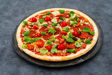 Sausage Pizza with Ham and tomatoes