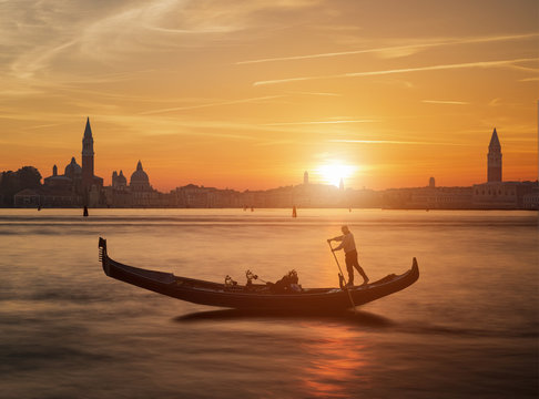 Fototapeta Gondola and the sunset in Venice Italy
