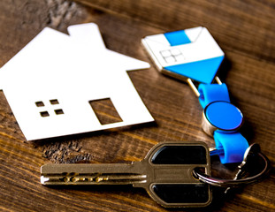 Fototapeta premium concept of buying house on wooden background close up