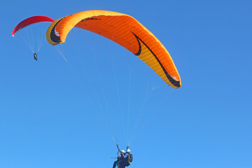 Tandem paraglider flying