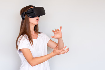 Smiling positive woman wearing virtual reality goggles headset, vr box. Connection, technology, new...