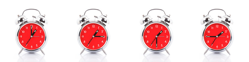 GROUP OF RED CLOCKS ON WHITE BACKGROUND. 01:00 01:15 01:30 01:45 13:00 13:15 13:30 13:45