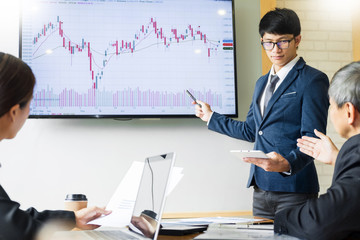 Business man speaker giving a talk stock profit graph presentation meeting audience in the conference modern office at board brainstorming meeting working concept