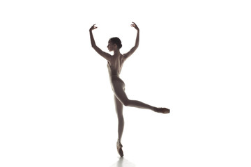 Young graceful female ballet dancer or classic ballerina dancing isolated on white studio....