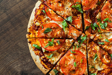 Pizza with Mozzarella cheese, Tomatoes, pepper, Spices and Fresh Basil. Italian pizza. Pizza...