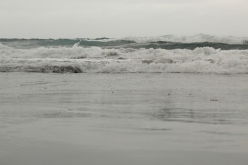 A close view of the sea undertow in the Almaciga black sand beach, in Tenerife, Canary