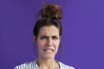 Fear of change, a woman experiences biting her lip. She looks with bewilderment and shame, worries...