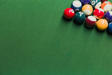 Close up of pool billiards snooker balls on green table with setup position. - Powered by Adobe