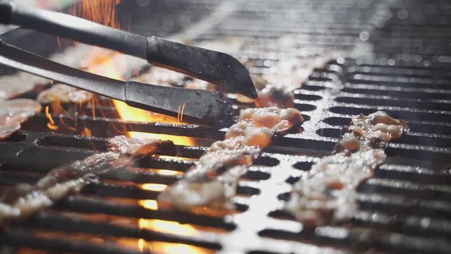 slice of bacon fried on a grill
