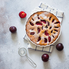 Homemade plum cake and fresh plums