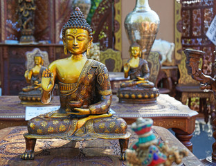 Indian souvenir statue of Buddha in a street shop.