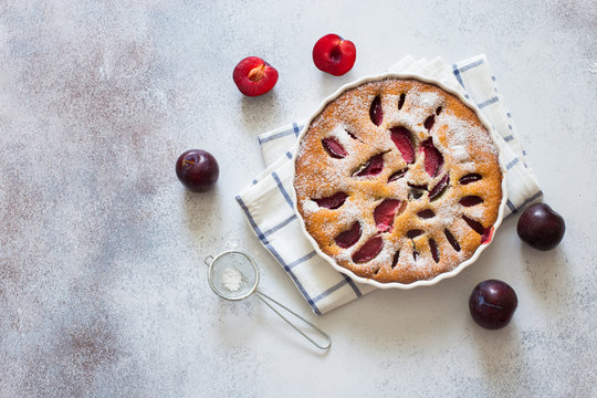 Homemade plum cake and fresh plums