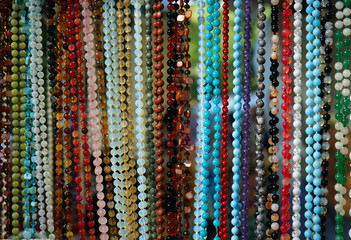 Jewelry made of natural stones in a street shop.