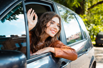 Beautiful woman sitting in her car