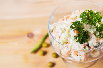 Salad, green peas, mayonnaise, greens,cucumbers, sour cream