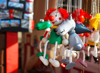 Wooden miniature toys clown and a variety of animals.