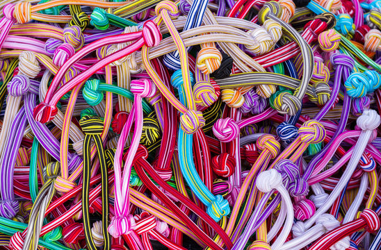 Hair multicolored rubber bands grouped for background © apimook