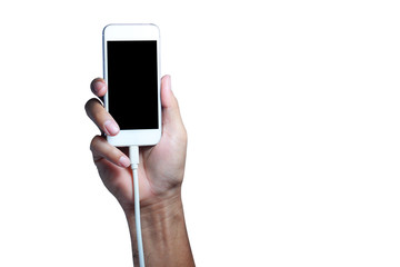 adult hand holding smart phone with electric  charger on white background isolated
