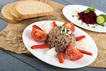 Exquisite Serving Buckwheat Porridge on White Wood Rustic Background