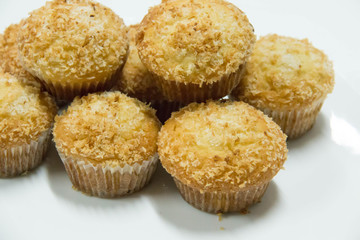  vanilla muffin with coconut powder background