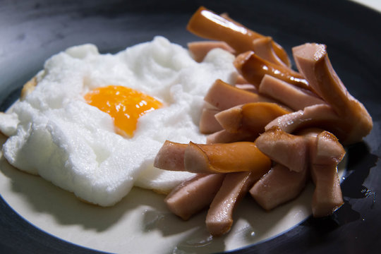 Fried egg and sausage breakfast