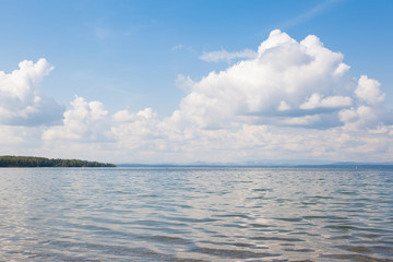 Calm beautiful landscape of blue lake and white clouds