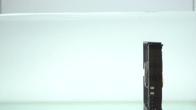 Put hard disk drive down in the water into cleaning.