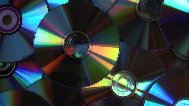 DZERZHINSK, RUSSIA - SEPTEMBER 2, 2018: Colorful Compact Discs Abstract background. Top view