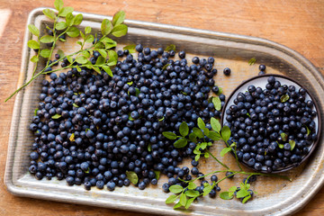 Fresh blueberries with leaves, top view. The concept of health