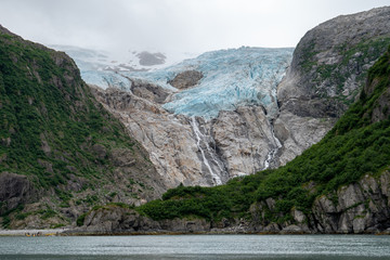 Hanging alpine glacier on an overcast day in Alaska's Kenai Fjords National Park in the summer
