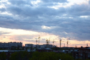 Fototapeta na wymiar sunset over house construction