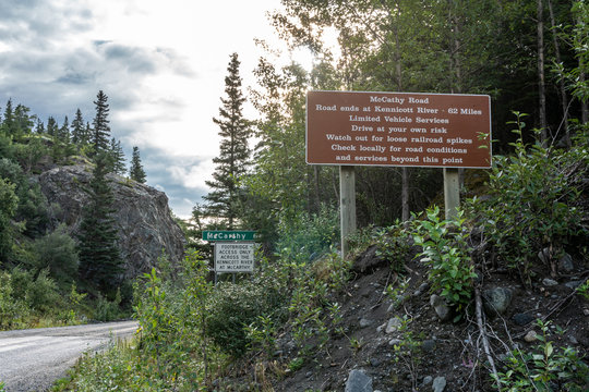 SIgn warning drivers of McCarthy Road from Chitina to McCarthy in Wrangell-St. Elias National Park is dangerous, gravel road with potholes and railroad spikes that can flatten tires