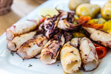 Obraz na płótnie Canvas Mediterranean Octopus with vegetables and potatoes