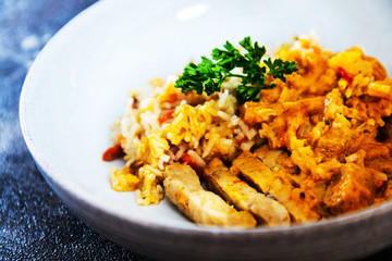 Rice and chicken on white plate
