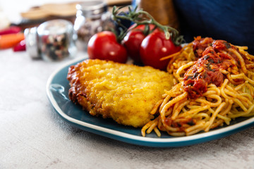 Escalope of spaghetti with tomatoes sauce and basil