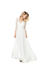 Fototapeta na wymiar beautiful young bride in stylish wedding dress isolated on white