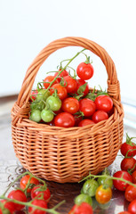 basket with red and green cherry tomatoes