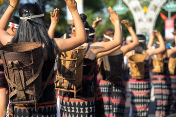 Fototapeta na wymiar Vietnamese ethnic minority people closeup wears traditional costumes performing a traditional dance at an event organised in Daklak, center highland of Vietnam