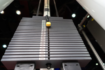 Black metallic or iron heavy plates stacked for sport, exercise, weight machine with kilogram and...